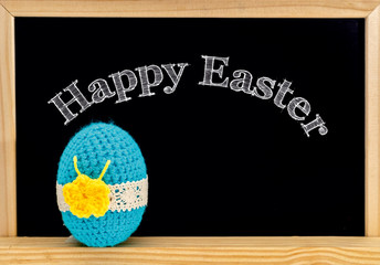 Easter frame with painted eggs and chalkboard. Happy Easter in white chalk..