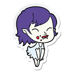 sticker of a cartoon vampire girl with blood on cheek
