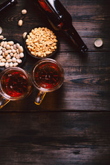 beer and snacks. friday party atmosphere, craft brewery, bar table. restaurant, pub, food concept. delicious lager drink and salted nuts