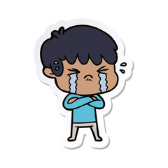sticker of a cartoon boy crying