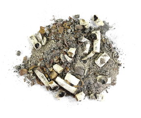 A pile of cigarette end stubs, butts & ash on a white background