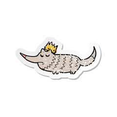 retro distressed sticker of a cartoon little wolf with crown
