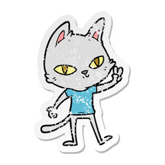 distressed sticker of a cartoon cat waving
