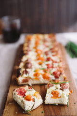 Homemade pie ( quiche) with ricotta, fresh colored tomatoes