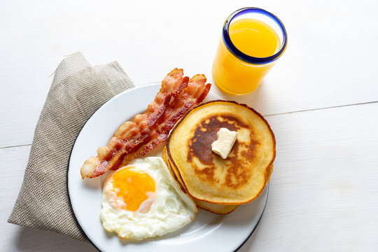 American Breakfast With Egg, Pancake And Bacon