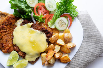 Traditional milanese beef and french fries