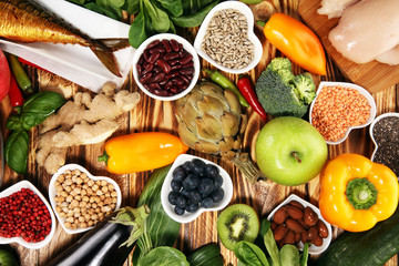 Healthy food clean eating selection. fruit, vegetable, seeds, superfood, cereals, leaf vegetable on...