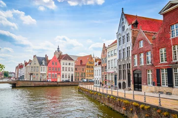 Fototapeten Beautiful canal and traditional houses in the old town of Bruges (Brugge), Belgium © Olena Zn