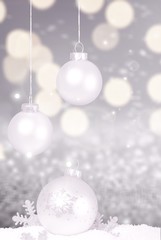 Fototapeta na wymiar Silver shiny christmas balls in snow isolated on white background. Banner