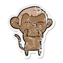 distressed sticker of a cartoon suspicious monkey
