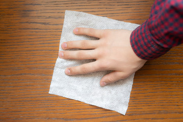 housekeeper wipe wooden surface with wet rag b