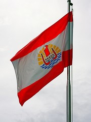 Naklejka na ściany i meble Flag of French Polynesia waving on a mast