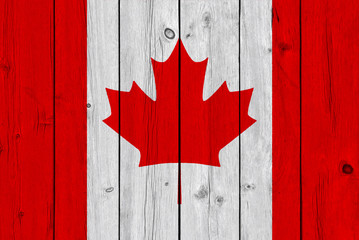Canada flag painted on old wood plank