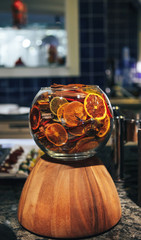 Dried citrus fruits in a glass bowl. Fruit chips
