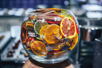 Dried citrus fruits in a glass bowl. Fruit chips