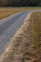 Stone road crushed with dry grass.