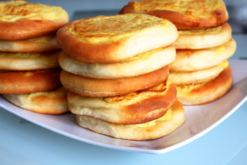 Shangi - bakery products from dough. Dough and potatoes. Close-up. Background.