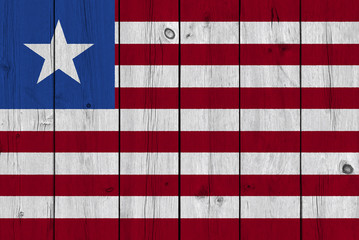 Fototapeta na wymiar Liberia flag painted on old wood plank