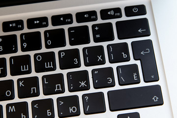 Close up of keyboard of a modern laptop. Enter button