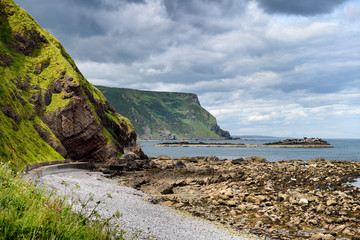 Gamrie Bay North Sea with sea cliffs at Gardenstown and footpath to Crovie, Banff, Aberdeenshire, Scotland, UK