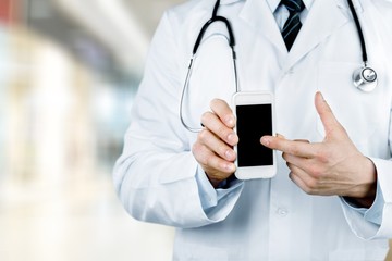 Young man doctor holding stethoscope