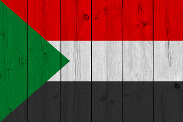 sudan flag painted on old wood plank