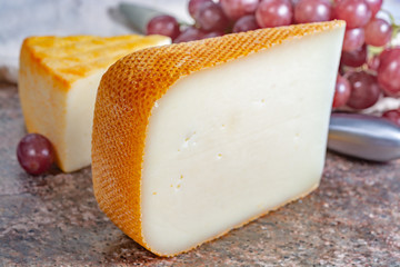 French yellow cheeses, Pur Brebis sheep melk cheese fron Pyrenees and Saint Paulin creamy, mild, semi-soft French cheese from pasteurized cow milk