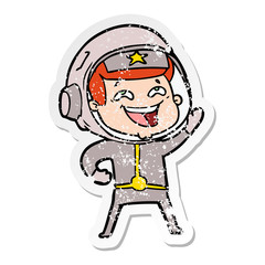 Obraz premium distressed sticker of a cartoon laughing astronaut