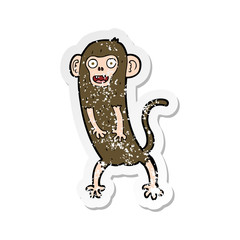 retro distressed sticker of a cartoon crazy monkey