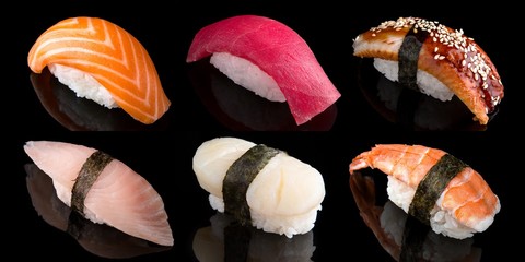 Sushi set of nigiri from salmon, tuna, shrimp, smoked eel, sea bass on black background....