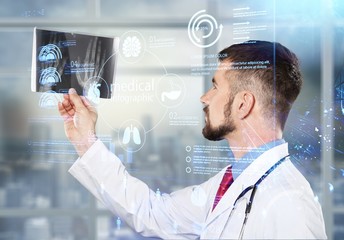 Young female scientist holding flask with reagent