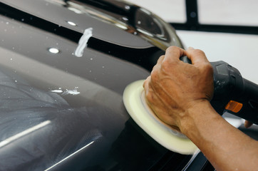 hands polishing cars
