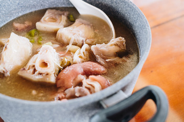 Pork in sour broth or pork in tamarind soup or known as Sinigang na Baboy in a stone pot is Filipino cuisine characterized by its sour and savoury taste associated with tamarind or guava or calamansi.