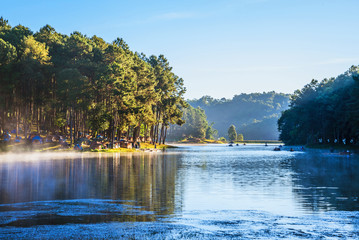 camping and travel  Beatiful nature panorama view of Pang Ung lake in the mist at sunrise.