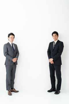 portrait of two asian businessman on white background