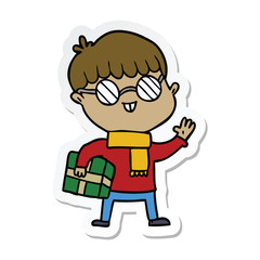 sticker of a cartoon boy wearing spectacles