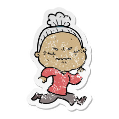 distressed sticker of a cartoon annoyed old lady