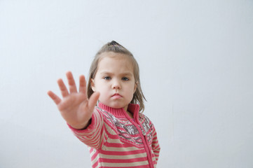 stop sign, toddlers palm saying stop with hands in front of himself. suspend of constraint on...