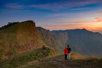 Fototapeta premium Rrainforest mountain viewpoint of Sanknokwua (San Knok Wua) hill at Khao Laem National Park. The highest peak in Kanchanaburi photo during sunrise.