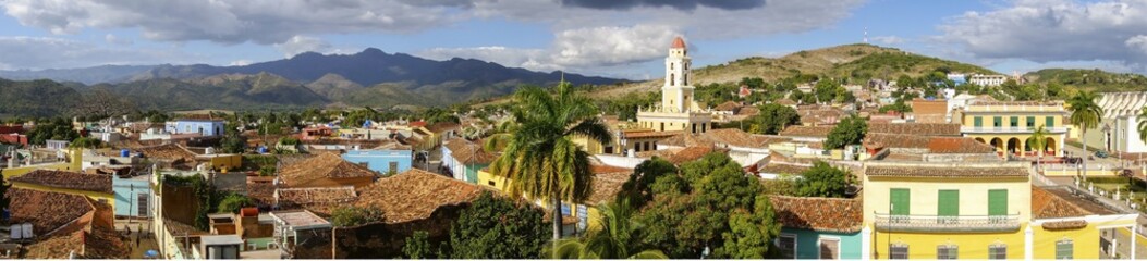 Fototapeta na wymiar Wide Panoramic View of City Skyline, Bell Tower on Plaza Mayor and Colonial Houses in Trinidad, Cuba - a Unesco World Heritage Site