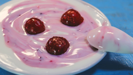 milk yogurt with berry jam.  frozen cherries.