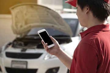 Agent man is calling the car service center because car is broken. The concept of customer service to home.