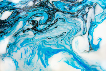 Abstract beautiful blue marble pattern with black color.The Eastern style of Ebru painting on water with acrylic paints swirls.A stylish mix of colors,natural luxury.