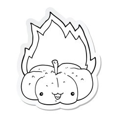 sticker of a cartoon flaming pumpkin