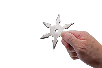 Close up Hand Holding Ninja Star Shuriken Isolated on White Background with Clipping Path and Copy Space © backiris