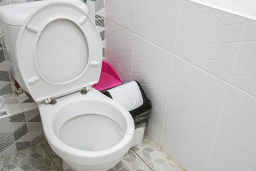 modern white ceramic toilet bowl in home bathroom