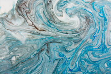 Abstract beautiful blue marble pattern with black color.The Eastern style of Ebru painting on water with acrylic paints swirls.A stylish mix of colors,natural luxury.