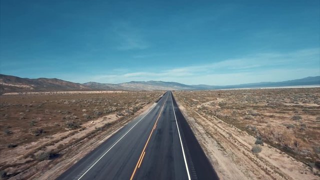 Above the road, aerial shot of the desert, 4k