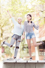 Young students standing in front of a camera outdoors