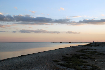  the pink dawn of sunset over the sea shore